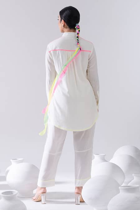 Shop Kacha Tanka Ivory Cotton Pom-poms Collared Thread Embroidered Short Kurta And Pant Set at Aza Fashions Shop_Kacha Tanka_Ivory Cotton Pom-poms Collared Thread Embroidered Short Kurta And Pant Set _at_Aza_Fashions