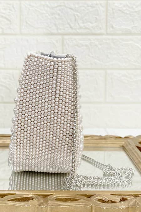 Shop Kainiche By Mehak Silver Embellished Semi Circle Shaped Clutch at Aza Fashions Shop_Kainiche By Mehak_Silver Embellished Semi Circle Shaped Clutch _at_Aza_Fashions