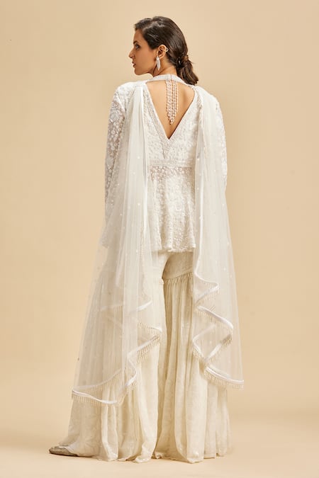 Shop Nitika Gujral Ivory Peplum Top And Gharara Georgette & Dupatta Net Embroidery Floral Set at Aza Fashions Shop_Nitika Gujral_Ivory Peplum Top And Gharara Georgette & Dupatta Net Embroidery Floral Set _at_Aza_Fashions