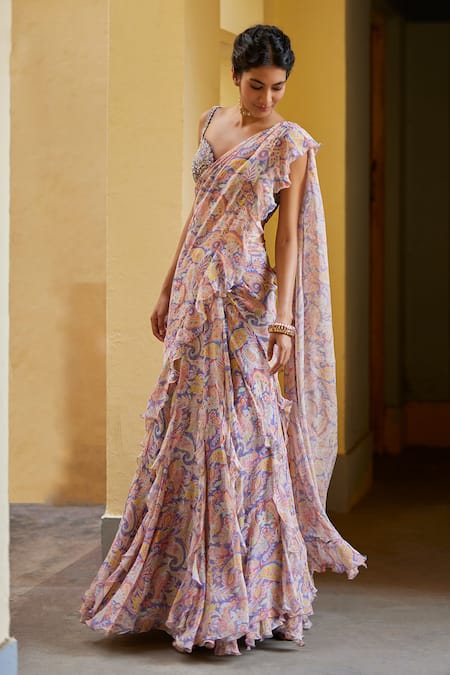 Shop Mrunalini Rao Purple Chiffon, Silk Embroidery, Zari Paisley Print Ruffle Saree With Blouse at Aza Fashions Shop_Mrunalini Rao_Purple Chiffon, Silk Embroidery, Zari Paisley Print Ruffle Saree With Blouse_at_Aza_Fashions