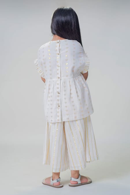 Shop Tiber Taber White Cotton Embroidery Heart Pattern Ruffled Top With Culottes at Aza Fashions Shop_Tiber Taber_White Cotton Embroidery Heart Pattern Ruffled Top With Culottes _at_Aza_Fashions