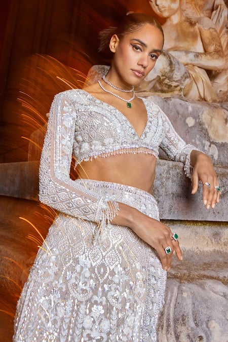 Shop Seema Gujral Silver Net Sequins, Crystals Plunge Neck Embroidered Slit Skirt And Blouse Set at Aza Fashions Shop_Seema Gujral_Silver Net Sequins, Crystals Plunge Neck Embroidered Slit Skirt And Blouse Set _at_Aza_Fashions