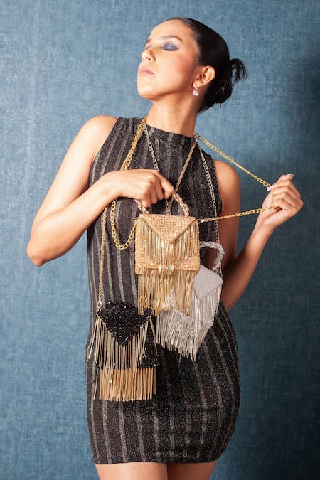 Shop Forever Noor Gold Embellished O Metallic Chain Tassel Handcrafted Bag at Aza Fashions Shop_Forever Noor_Gold Embellished O Metallic Chain Tassel Handcrafted Bag _at_Aza_Fashions