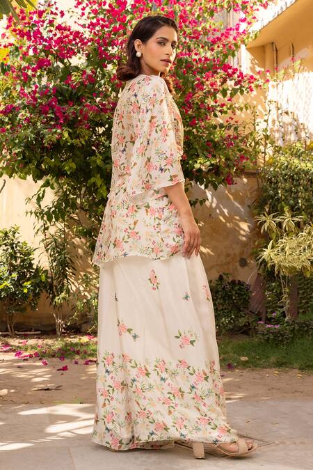 Shop Suruchi Parakh Off White Georgette, Crepe V-neck Flower Print Twist Top And Palazzo Set at Aza Fashions Shop_Suruchi Parakh_Off White Georgette, Crepe V-neck Flower Print Twist Top And Palazzo Set _at_Aza_Fashions