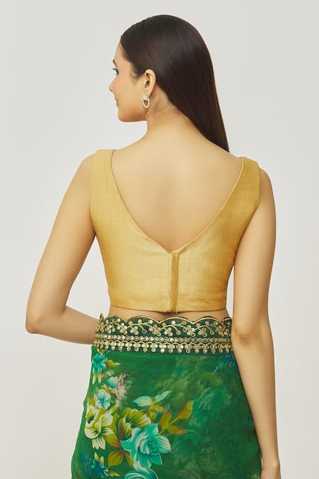 Shop Naintara Bajaj Gold Muslin Plunge Neck Metallic Sleeveless Solid Blouse at Aza Fashions Shop_Naintara Bajaj_Gold Muslin Plunge Neck Metallic Sleeveless Solid Blouse _at_Aza_Fashions