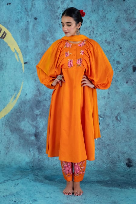 Shop Kacha Tanka Orange Cotton Satin Applique Floral Round Neck Balloon Sleeve Anarkali Set at Aza Fashions Shop_Kacha Tanka_Orange Cotton Satin Applique Floral Round Neck Balloon Sleeve Anarkali Set _at_Aza_Fashions