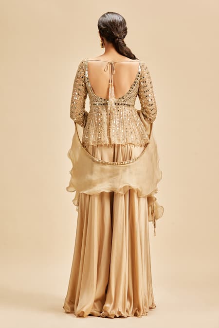 Shop Nitika Gujral Gold Sharara Satin Embroidery Beads Sweetheart Neck Mirror Work Peplum Top Set at Aza Fashions Shop_Nitika Gujral_Gold Sharara Satin Embroidery Beads Sweetheart Neck Mirror Work Peplum Top Set _at_Aza_Fashions