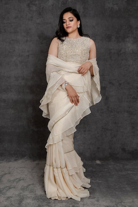 Shop Sunita Bhandari Ivory Viscose, Organza, Net Ruffle Pre-draped Saree With Embroidered Blouse at Aza Fashions Shop_Sunita Bhandari_Ivory Viscose, Organza, Net Ruffle Pre-draped Saree With Embroidered Blouse _at_Aza_Fashions