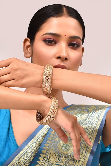 Shop_Zevar By Geeta_Gold Plated Imitation Diamonds Quatrefoil Cut Work Kada - Set Of 2 _at_Aza_Fashions