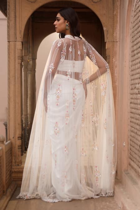 Shop Dheeru Taneja Ivory Chiffon, Net Sequins, Beads Scoop Nazma Sheer Cape And Pre-draped Saree Set at Aza Fashions Shop_Dheeru Taneja_Ivory Chiffon, Net Sequins, Beads Scoop Nazma Sheer Cape And Pre-draped Saree Set _at_Aza_Fashions