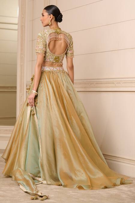 Shop Tarun Tahiliani Gold Organza Stones, Tassels, Embroidery Sweetheart Neck Floral Lehenga Set at Aza Fashions Shop_Tarun Tahiliani_Gold Organza Stones, Tassels, Embroidery Sweetheart Neck Floral Lehenga Set_at_Aza_Fashions