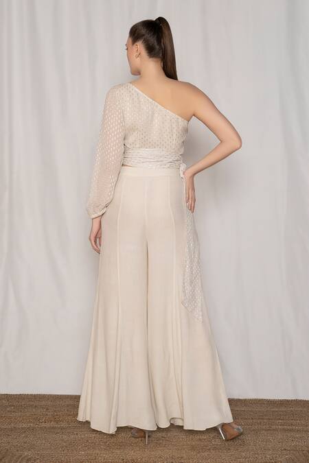 Shop Amrta By Guneet Kondal Off White Viscose Metallic Thread Embroidered Draped Top And Flared Pant Set at Aza Fashions Shop_Amrta By Guneet Kondal_Off White Viscose Metallic Thread Embroidered Draped Top And Flared Pant Set_at_Aza_Fashions