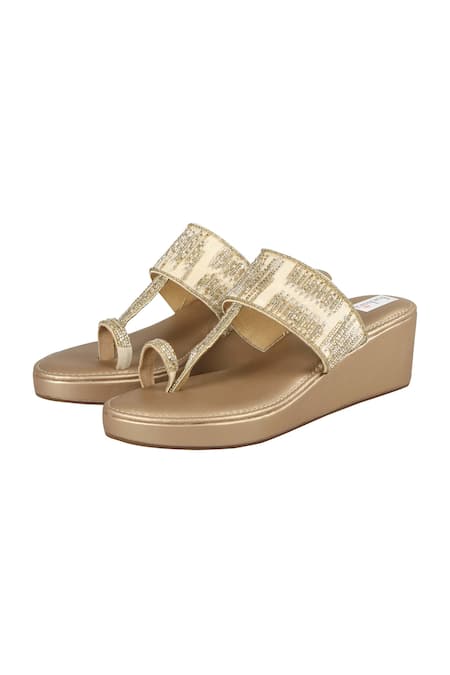 Shop Fuchsia by aashaka mehta Gold Cut Work Dana Kolhapuri Wedges at Aza Fashions Shop_Fuchsia by aashaka mehta_Gold Cut Work Dana Kolhapuri Wedges _at_Aza_Fashions