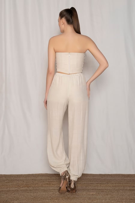 Shop Amrta By Guneet Kondal Gold Viscose Beads, Sequins, Embroidery Sweetheart Neck Bustier And Jogger Set at Aza Fashions Shop_Amrta By Guneet Kondal_Gold Viscose Beads, Sequins, Embroidery Sweetheart Neck Bustier And Jogger Set _at_Aza_Fashions
