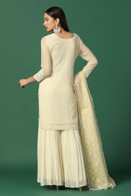 Shop Two Sisters By Gyans Cream Georgette, Organza Embroidery, Sequins Round Cut-dana Kurta Sharara Set at Aza Fashions Shop_Two Sisters By Gyans_Cream Georgette, Organza Embroidery, Sequins Round Cut-dana Kurta Sharara Set _at_Aza_Fashions