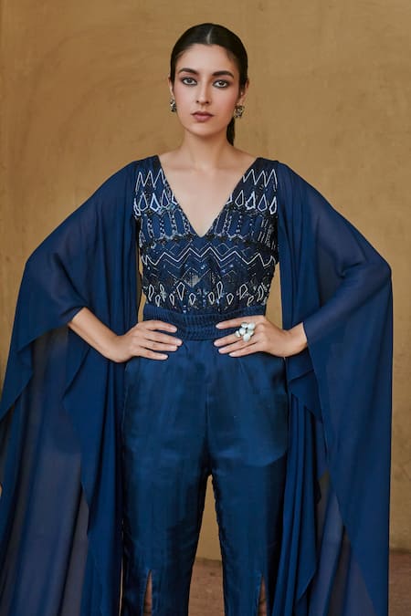 Shop Studio Radical Blue Crepe, Georgette Beads V-neck Cape Sleeved Embellished Slit Jumpsuit at Aza Fashions Shop_Studio Radical_Blue Crepe, Georgette Beads V-neck Cape Sleeved Embellished Slit Jumpsuit _at_Aza_Fashions