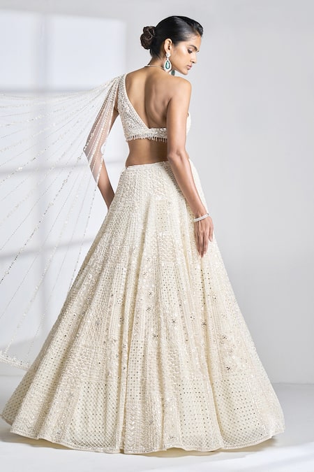 Shop Seema Gujral Ivory Net Pearl, Sequin And Beads One Shoulder Blouse & Lehenga Set at Aza Fashions Shop_Seema Gujral_Ivory Net Pearl, Sequin And Beads One Shoulder Blouse & Lehenga Set _at_Aza_Fashions