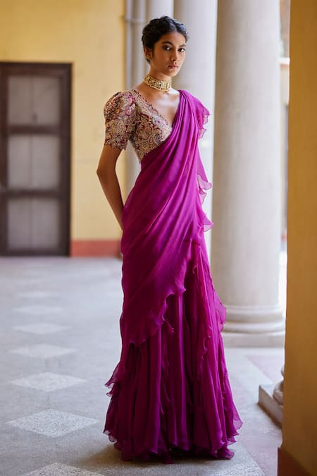 Shop Mrunalini Rao Magenta Chiffon, Silk Zari, Embroidery V-neck Ruffle Saree With Floral Blouse at Aza Fashions Shop_Mrunalini Rao_Magenta Chiffon, Silk Zari, Embroidery V-neck Ruffle Saree With Floral Blouse _at_Aza_Fashions