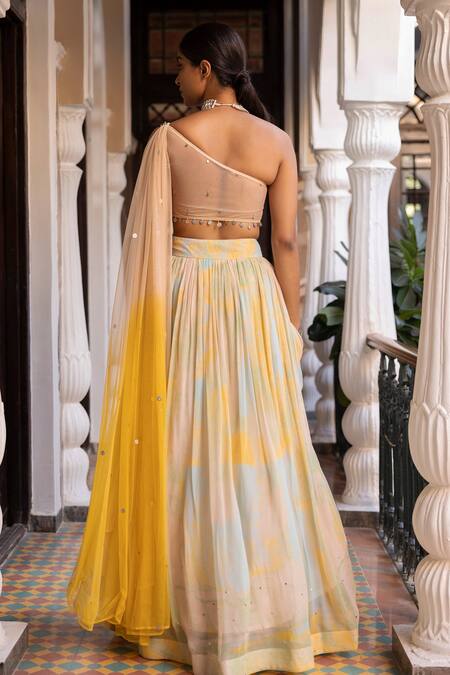Shop Basanti - Kapde Aur Koffee Yellow Georgette, Net Sequins, Embroidery One Shoulder Top And Lehenga Set at Aza Fashions Shop_Basanti - Kapde Aur Koffee_Yellow Georgette, Net Sequins, Embroidery One Shoulder Top And Lehenga Set_at_Aza_Fashions