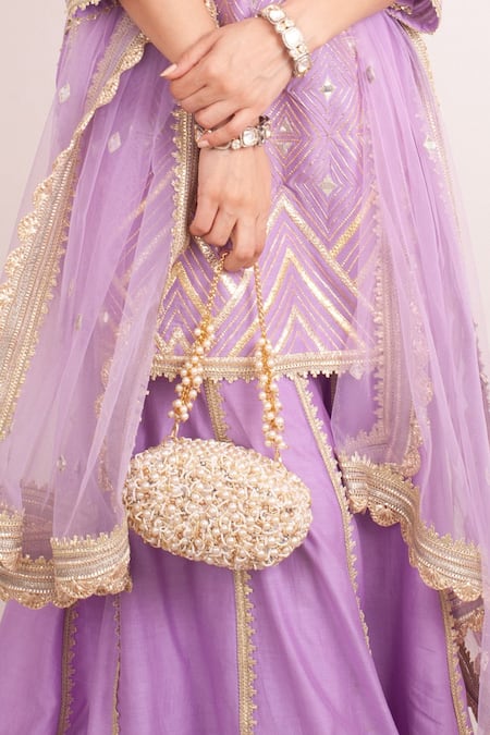 Shop Forever Noor Beige Embellished Zuri Oval Shaped Clutch at Aza Fashions Shop_Forever Noor_Beige Embellished Zuri Oval Shaped Clutch _at_Aza_Fashions