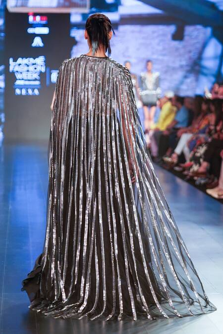 Shop_RUDRAKSH DWIVEDI_Silver Plastic Sequin Trim And Tulle Lining Butter Crepe Platinum Flared Cape_at_Aza_Fashions