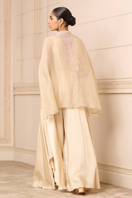 Shop Tarun Tahiliani Beige Modal, Satin Chikankari Cape And Flared Trouser Set at Aza Fashions Shop_Tarun Tahiliani_Beige Modal, Satin Chikankari Cape And Flared Trouser Set_at_Aza_Fashions