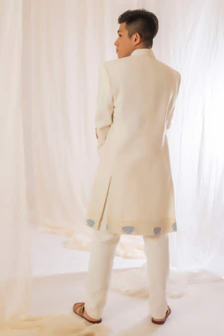 Shop Vaani Beswal Off White Handwoven Silk Floral, Butti Asymmetric Bandhgala at Aza Fashions Shop_Vaani Beswal_Off White Handwoven Silk Floral, Butti Asymmetric Bandhgala _at_Aza_Fashions