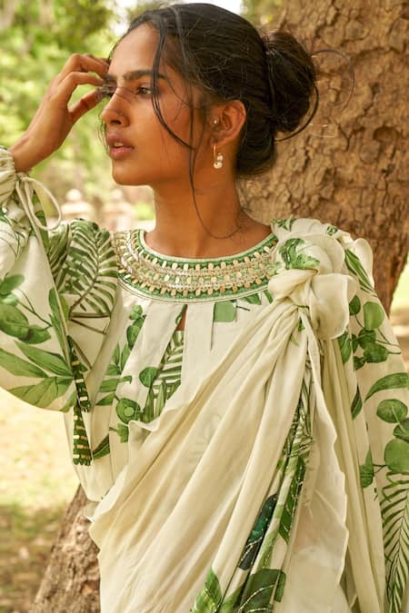Off White Saree with bottle green round neck blouse