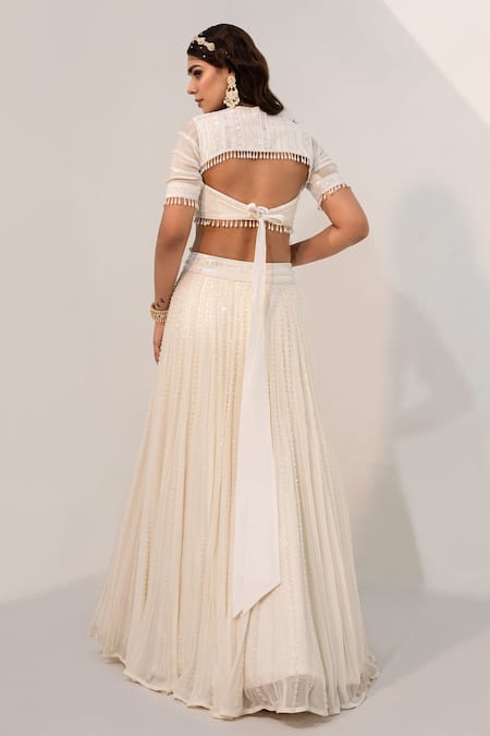 Shop_Nayna Kapoor_Ivory Georgette Embellished Cutdana Cut-out Flower Sequin Bridal Lehenga Set _at_Aza_Fashions