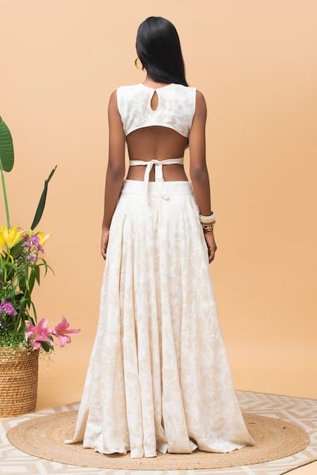 Shop Rishi and Vibhuti Ivory Cotton Cut Work Round Neck Pearl Crop Top And Skirt Set at Aza Fashions Shop_Rishi and Vibhuti_Ivory Cotton Cut Work Round Neck Pearl Crop Top And Skirt Set _at_Aza_Fashions