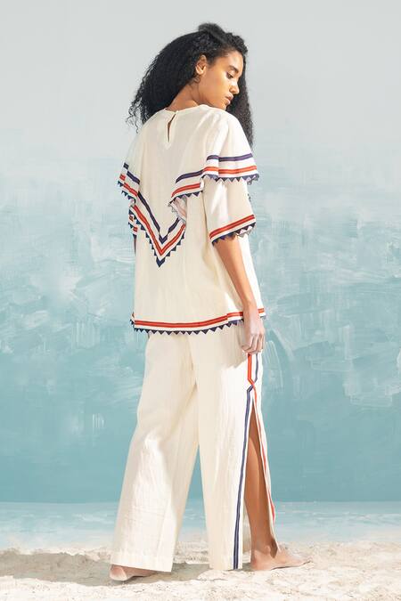 Shop Ikai By Ragini Ahuja Ivory Cotton, Silk, Chanderi Embroidery Round Neck Nile Shoulder Frill Top at Aza Fashions Shop_Ikai By Ragini Ahuja_Ivory Cotton, Silk, Chanderi Embroidery Round Neck Nile Shoulder Frill Top_at_Aza_Fashions