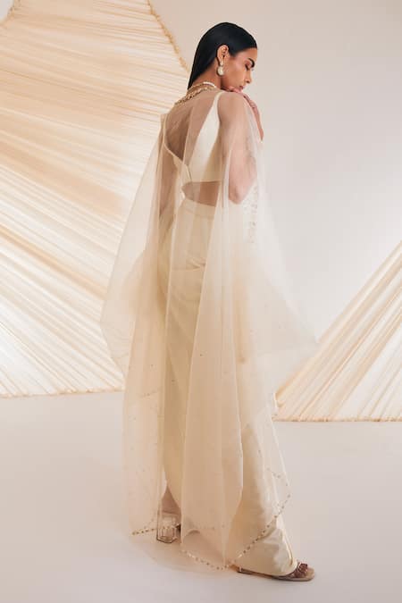 Shop Divya Aggarwal Ivory Satin Crystals, Pearls, Sequins V-neck Leaf Embroidered Cape Skirt Set at Aza Fashions Shop_Divya Aggarwal_Ivory Satin Crystals, Pearls, Sequins V-neck Leaf Embroidered Cape Skirt Set _at_Aza_Fashions