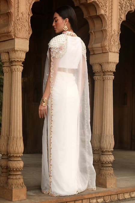 Shop Dheeru Taneja Ivory Chanderi, Crepe, Organza Sequins Naaz Sheer Long Cape And Draped Skirt Set at Aza Fashions Shop_Dheeru Taneja_Ivory Chanderi, Crepe, Organza Sequins Naaz Sheer Long Cape And Draped Skirt Set _at_Aza_Fashions