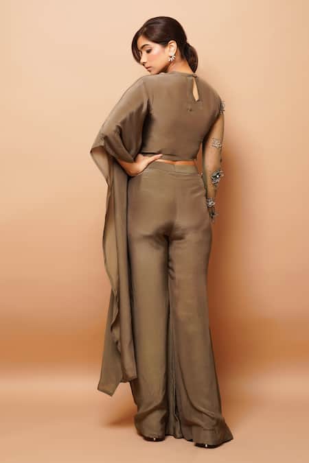 Shop Ahi Clothing Green Crepe Embroidery, Cut Work, Asymmetric Sleeve Top And Bell Bottoms Pant Set at Aza Fashions Shop_Ahi Clothing_Green Crepe Embroidery, Cut Work, Asymmetric Sleeve Top And Bell Bottoms Pant Set _at_Aza_Fashions