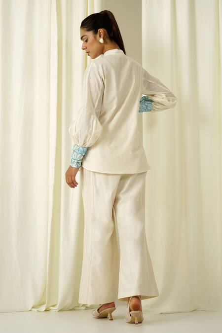 Shop Sakshi Khetterpal Ivory Chanderi Beads, Pearls, Embroidery Collared Shirt And Pant Set at Aza Fashions Shop_Sakshi Khetterpal_Ivory Chanderi Beads, Pearls, Embroidery Collared Shirt And Pant Set _at_Aza_Fashions