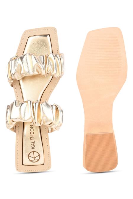 Shop Kaltheos Gold Plain Maureen Metallic Ruffle Strap Block Heels at Aza Fashions Shop_Kaltheos_Gold Plain Maureen Metallic Ruffle Strap Block Heels_at_Aza_Fashions