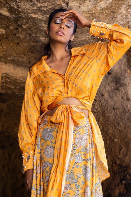 Shop Yogita Kadam Yellow Muslin Pearls, Tassels Collared High-low Shirt And Draped Skirt Set at Aza Fashions Shop_Yogita Kadam_Yellow Muslin Pearls, Tassels Collared High-low Shirt And Draped Skirt Set_at_Aza_Fashions