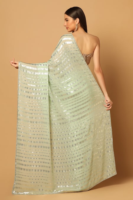 Shop Two Sisters By Gyans Green Georgette Sequins Stripe Pattern Saree With Unstitched Blouse Fabric at Aza Fashions Shop_Two Sisters By Gyans_Green Georgette Sequins Stripe Pattern Saree With Unstitched Blouse Fabric _at_Aza_Fashions