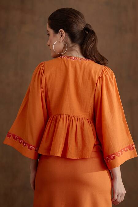 Shop_Nikasha_Orange Cotton, Silk Embroidery, Tassels Round Neck Placement Peplum Top _at_Aza_Fashions