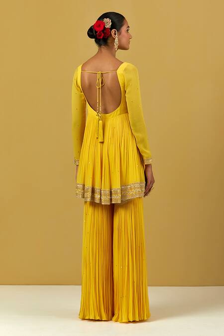 Shop Ikshita Choudhary Yellow Georgette Embroidery Round Neck Hand Peplum Kurta at Aza Fashions Shop_Ikshita Choudhary_Yellow Georgette Embroidery Round Neck Hand Peplum Kurta_at_Aza_Fashions