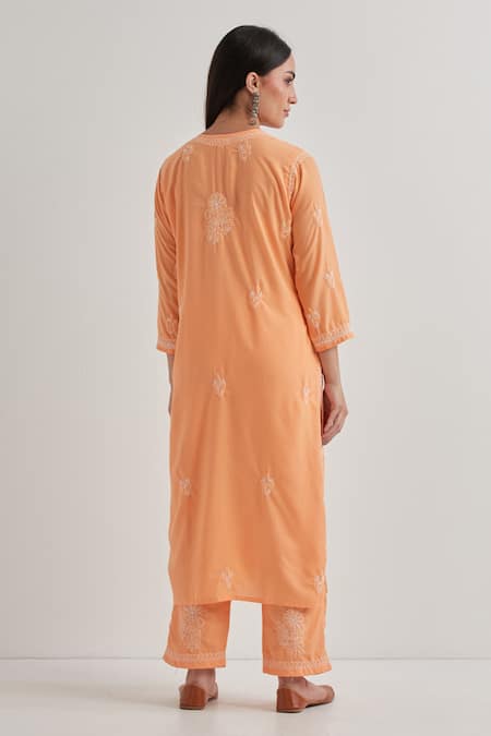Shop Priya Chaudhary Peach Cotton Embroidery Split V-neck Chikankari Kurta Set at Aza Fashions Shop_Priya Chaudhary_Peach Cotton Embroidery Split V-neck Chikankari Kurta Set _at_Aza_Fashions