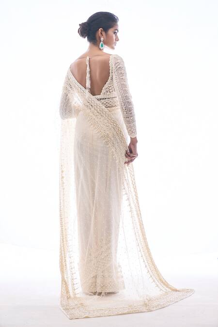 Shop Seema Gujral Ivory Net Sequin And Beads U Neck Embroidered Saree With Blouse at Aza Fashions Shop_Seema Gujral_Ivory Net Sequin And Beads U Neck Embroidered Saree With Blouse_at_Aza_Fashions