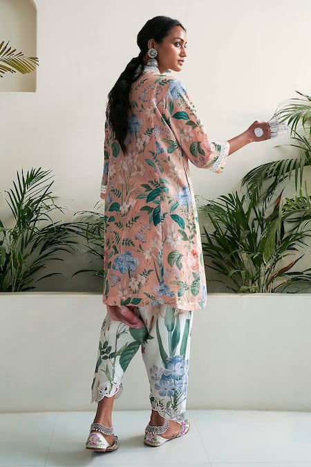 Shop Sage Saga Peach Linen Embroidery V-neck Amaryllis Floral Print Tunic at Aza Fashions Shop_Sage Saga_Peach Linen Embroidery V-neck Amaryllis Floral Print Tunic _at_Aza_Fashions