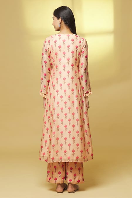 Shop Kalakaari By Sagarika Peach Chanderi Tassels, Mirrors Round Neck Blooming Flower Print Kurta With Pant at Aza Fashions Shop_Kalakaari By Sagarika_Peach Chanderi Tassels, Mirrors Round Neck Blooming Flower Print Kurta With Pant _at_Aza_Fashions