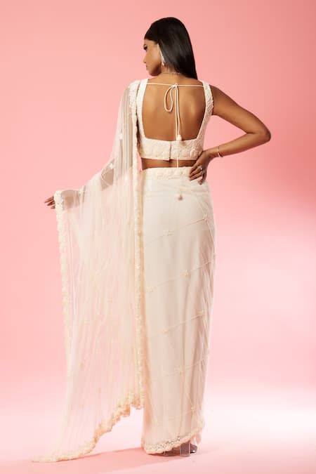 Shop Quench A Thirst Ivory Georgette, Net Sequins, Cut Pre-stitched Saree With Embroidered Blouse at Aza Fashions Shop_Quench A Thirst_Ivory Georgette, Net Sequins, Cut Pre-stitched Saree With Embroidered Blouse _at_Aza_Fashions