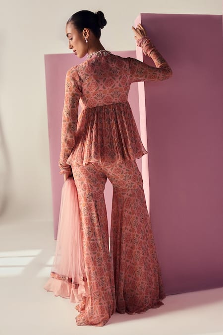 Shop Ridhi Mehra Pink Peplum And Gharara Chiffon Printed Floral V Neck Laiqa Top Set at Aza Fashions Shop_Ridhi Mehra_Pink Peplum And Gharara Chiffon Printed Floral V Neck Laiqa Top Set _at_Aza_Fashions