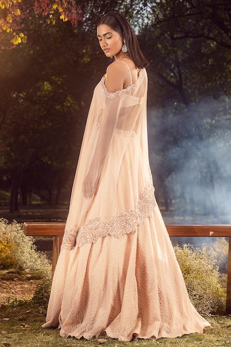 Shop Nitika Gujral Peach Sweetheart Neck Geometric Embroidered Lehenga And Cape Set at Aza Fashions Shop_Nitika Gujral_Peach Sweetheart Neck Geometric Embroidered Lehenga And Cape Set _at_Aza_Fashions
