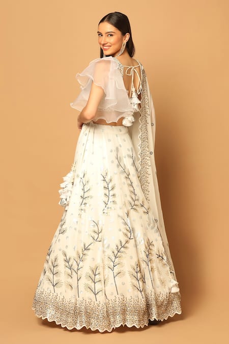 Shop Two Sisters By Gyans White Georgette Beads, Sequins V-neck Garden Embroidered Lehenga Set at Aza Fashions Shop_Two Sisters By Gyans_White Georgette Beads, Sequins V-neck Garden Embroidered Lehenga Set _at_Aza_Fashions