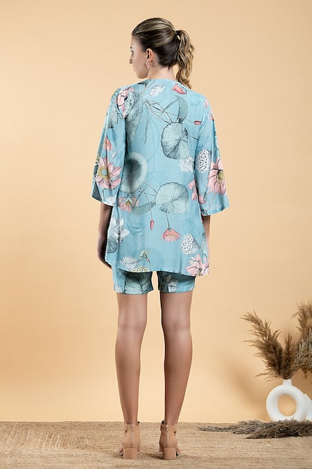 Shop Divi By Sonal Khandelwal Sky Blue Muslin, Modal Round Neck Nelumbo Printed Cape And Shorts Set at Aza Fashions Shop_Divi By Sonal Khandelwal_Sky Blue Muslin, Modal Round Neck Nelumbo Printed Cape And Shorts Set _at_Aza_Fashions