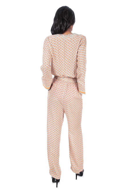 Shop Monisha Jaising Peach Cotton Silk Printed Floral Pattern Round Jumpsuit at Aza Fashions Shop_Monisha Jaising_Peach Cotton Silk Printed Floral Pattern Round Jumpsuit_at_Aza_Fashions